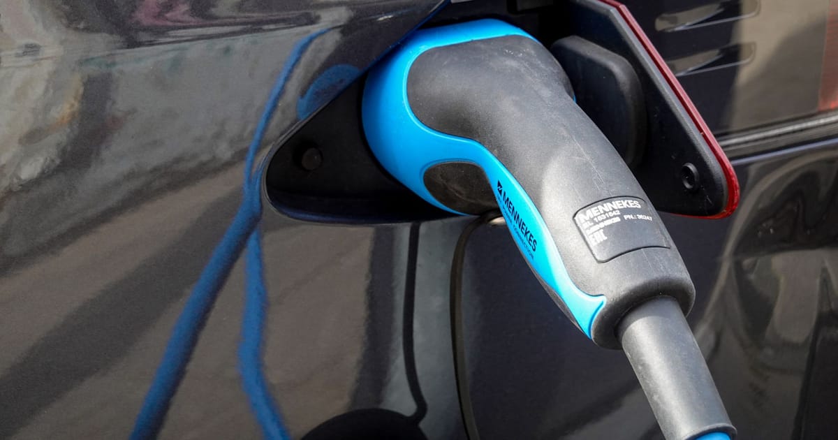 A Type 2 charging connector plugged into a charge port.